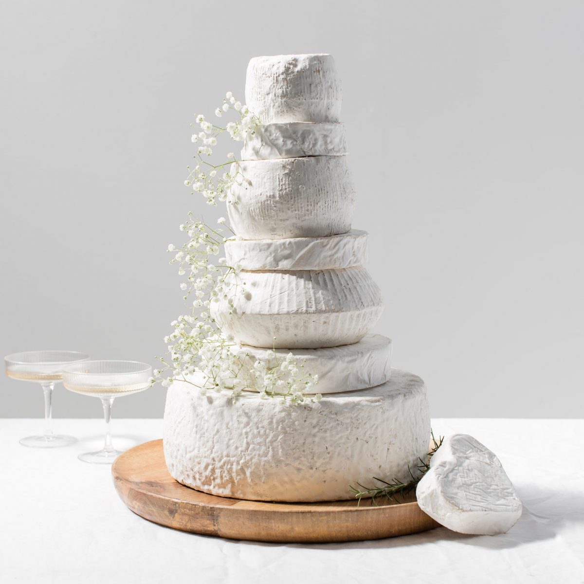 All White Sharpham Wedding Cheese Cake Styled with flowers